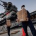 U.S. Navy sailors assigned to the aircraft carrier USS Theodore Roosevelt move meals, ready to eat (MREs) for sailors who have tested negative for coronavirus disease (COVID-19) and are asymptomatic while quarantined at local hotels in an effort to implem