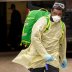 An Emergency Medical Technician (EMT) wearing personal protective equipment (PPE) walks out of the Cobble Hill Health Center nursing home during the ongoing outbreak of the coronavirus disease (COVID-19) in the Brooklyn borough of New York, U.S., April 17