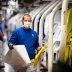 Workers wear protective masks at the Volkswagen assembly line after VW re-starts Europe's largest car factory after coronavirus shutdown in Wolfsburg, Germany, April 27, 2020, as the spread of the coronavirus disease (COVID-19) continues. Swen Pfoertner/P