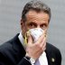 New York Governor Andrew Cuomo holds a protective mask to his face as he arrives for a daily briefing at New York Medical College during the outbreak of the coronavirus disease (COVID-19) in Valhalla, New York, U.S., May 7, 2020. REUTERS/Mike Segar