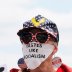 A woman wears a mask reading "Tastes Like Socialism" at a protest against restrictions implemented in response to the coronavirus disease (COVID-19) outbreak near Massachusetts Governor Charlie Baker’s house in Swampscott, Massachusetts, U.S., May 16, 202