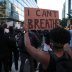 A protester holds up a "I can't breathe" sign during a rally against the death in Minneapolis police custody of George Floyd, in Washington, D.C., U.S. May 31, 2020. REUTERS/Jonathan Ernst