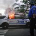 A NYPD police car is sets on fire as protesters clash with police during a march against the death in Minneapolis police custody of George Floyd, in the Brooklyn borough of New York City, U.S., May 30, 2020. REUTERS/Eduardo Munoz
