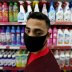 A Palestinian man wearing a mask looks on as he stands in front of disinfectants and cleaning products in a supermarket amid the coronavirus disease (COVID-19) crisis, in the southern Gaza Strip June 9, 2020. REUTERS/Ibraheem Abu Mustafa