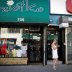 Beata Widziszewski, owner of Backstage Boutique clothing store which has been closed for three months, takes a break outside her shop as the phase one reopening of New York City continues during the outbreak of the coronavirus disease (COVID-19) in the Br