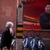 A woman with a protective mask is seen past a portrait of Chinese President Xi Jinping on a street as the country is hit by an outbreak of the coronavirus, in Shanghai, China March 12, 2020. REUTERS/Aly Song