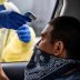 Joe Garcia has his heart rate and temperature checked before getting tested for the coronavirus disease (COVID-19) during its outbreak, in Austin, Texas, U.S., June 28, 2020. REUTERS/Sergio Flores