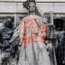 A defaced statue is pictured across from a protest to defund the police in a place they are calling the "City Hall Autonomous Zone" in support of "Black Lives Matter" in the Manhattan borough of New York City, New York, U.S., June 30, 2020. REUTERS/Carlo 