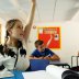 A girl gestures in a classroom at Watlington Primary School during the last day of school, amid the coronavirus disease (COVID-19) outbreak, in Watlington , Britain, July 17, 2020. REUTERS/Eddie Keogh