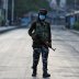 An Indian Central Reserve Police Force (CRPF) officer patrols on an empty street during a lockdown on the first anniversary of the revocation of Kashmir's autonomy, in Srinagar August 5, 2020. REUTERS/Danish Ismail/