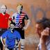 A man walks past a mural signed by "TV Boy" and depicting Russian President Vladimir Putin, U.S. President Donald Trump and Italian Prime Minister Giuseppe Conte as soccer players in downtown Rome, Italy June 15, 2018. REUTERS/Tony Gentile NO RESALES. NO 