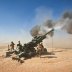 Marines with Charlie Battery, 1st Battalion, 12th Marine Regiment, fire an M982 Excalibur round from an M777 howitzer during a recent fire support mission. Afghanistan. 1 October 2011. U.S. Marine Corps.