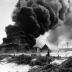 Battle of Midway, June 1942. Burning oil tanks on Sand Island, Midway, following the Japanese air attack delivered on the morning of 4 June 1942. 