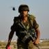 An Israeli soldier watches a chopper land on a military area in Kerem Shalom at the border with Gaza June 28, 2006. Israel fired artillery shells into the northern Gaza Strip on Wednesday as troops and tanks prepared to widen an offensive aimed at forcing