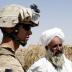 A U.S. Marine from 2nd platoon, F company, 5th batalion, 10th Marines, meets an Afghan villager during a patrol in southern Afghanistan June 28, 2009. After five years coping with the most dangerous province in Iraq, the U.S. Marines have been given their