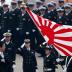 Japan's Prime Minister Shinzo Abe (L) reviews members of Japan Self-Defense Force (JSDF) during the JSDF Air Review, to celebrate 60 years since the service's founding at Hyakuri air base in Omitama, northeast of Tokyo October 26, 2014. About 740 personne