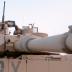 U.S. troops sit on an Abrams M1 tank as they prepare to join a military offensive in the northern Iraq city of Tal Afar September 10, 2005.