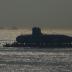 India's third Scorpene-class submarine INS Karanj is seen silhouetted as a tugboat pulls it during its launch at the Mazagon Dock Ltd. naval shipbuilding yard, in Mumbai, India January 31, 2018. REUTERS/Shailesh Andrade TPX IMAGES OF THE DAY