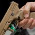 A man holds a Glock handgun during the annual National Rifle Association (NRA) convention in Dallas, Texas, U.S., May 6, 2018. REUTERS/Lucas Jackson