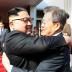 South Korean President Moon Jae-in bids fairwell to North Korean leader Kim Jong Un as he leaves after their summit at the truce village of Panmunjom, North Korea, in this handout picture provided by the Presidential Blue House on May 26, 2018. The Presid