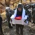 A South Korean soldier carries a casket containing a piece of bone believed to be the remains of an unidentified South Korean soldier killed in the Korean War in the Demilitarized Zone (DMZ) dividing the two Koreas in Cheorwon, South Korea October 25, 201