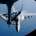 An FA-18 air fighter from the U.S. carrier George Washington is being refuelled by an air tanker over the Pacific near Okinawa Island, southern Japan, December 9, 2010. REUTERS/Kyodo (JAPAN - Tags: MILITARY TRANSPORT) JAPAN OUT. NO COMMERCIAL OR EDITORIAL