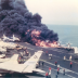 In the first moments of the U.S.S. Forrestal disaster, an A-4 Skyhawk burns immediately after its fuel tank is ruptured by a Zuni rocket. 29 July 1967. U.S. Navy.
