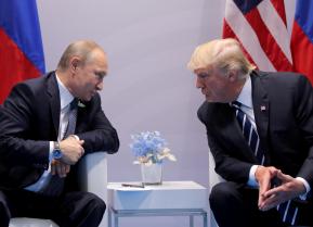 Russia's President Vladimir Putin talks to U.S. President Donald Trump during their bilateral meeting at the G20 summit in Hamburg, Germany, July 7, 2017. REUTERS/Carlos Barria