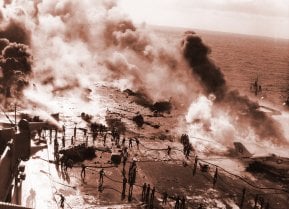View of the U.S. Navy aircraft carrier USS Enterprise (CVAN-65) underway in the Pacific Ocean showing the crew fighting a fire on the flight deck that occurred as the carrier was conducting air operations near Hawaii.