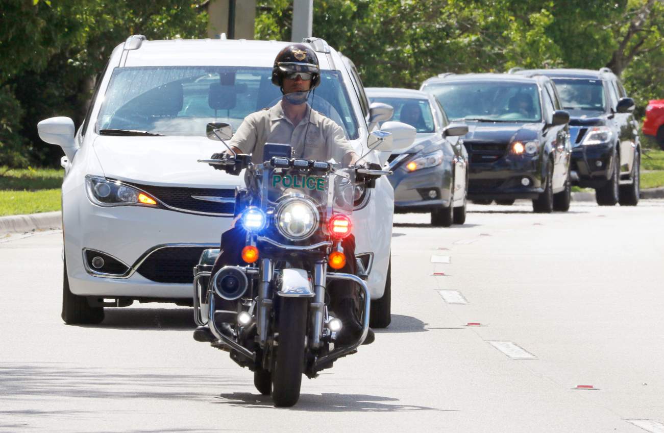 Miami-Dade police motorcycle officers escort a motorcade to FBI headquarters in Miramar, Florida, U.S. October 26, 2018. REUTERS/Joe Skipper