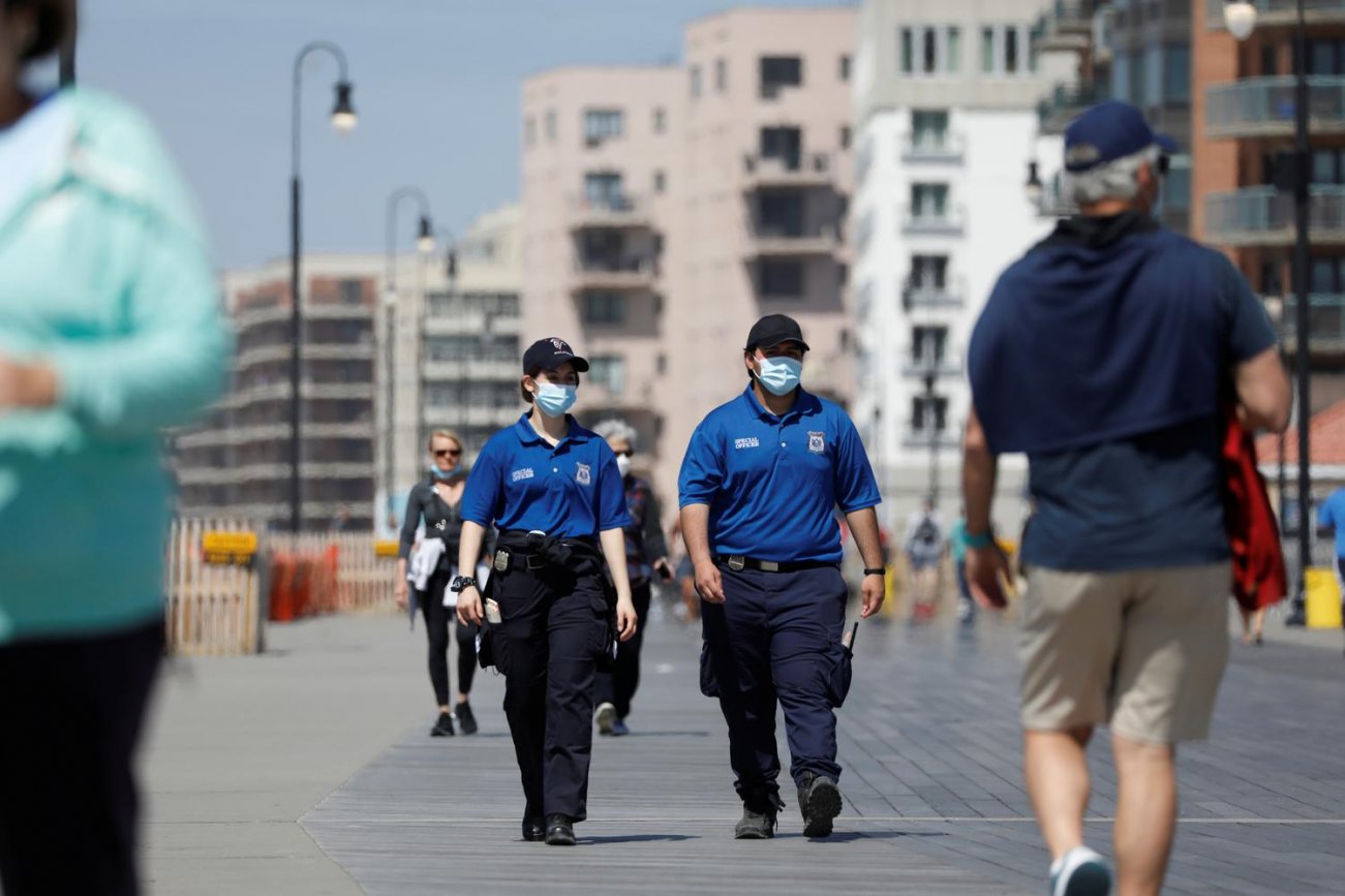 Special Police Officers patrol the boardwalk at Long Beach on the first day that New York beaches were opened ahead of the Memorial Day weekend following the outbreak of the coronavirus disease (COVID-19) on Long Island, New York, U.S., May 22, 2020. REUT